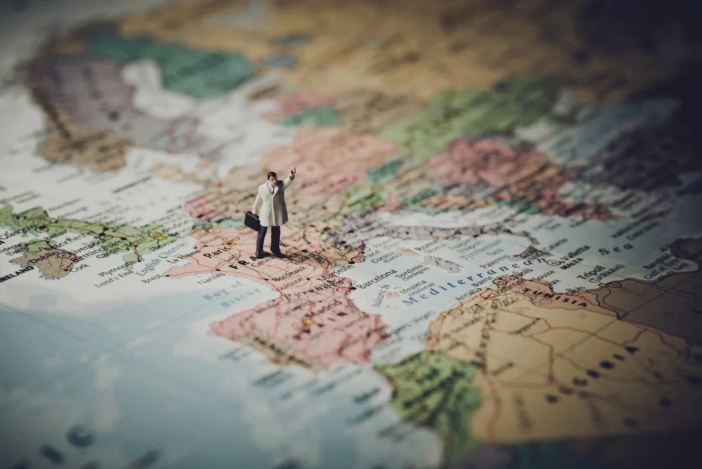 miniature figurine on top of a map